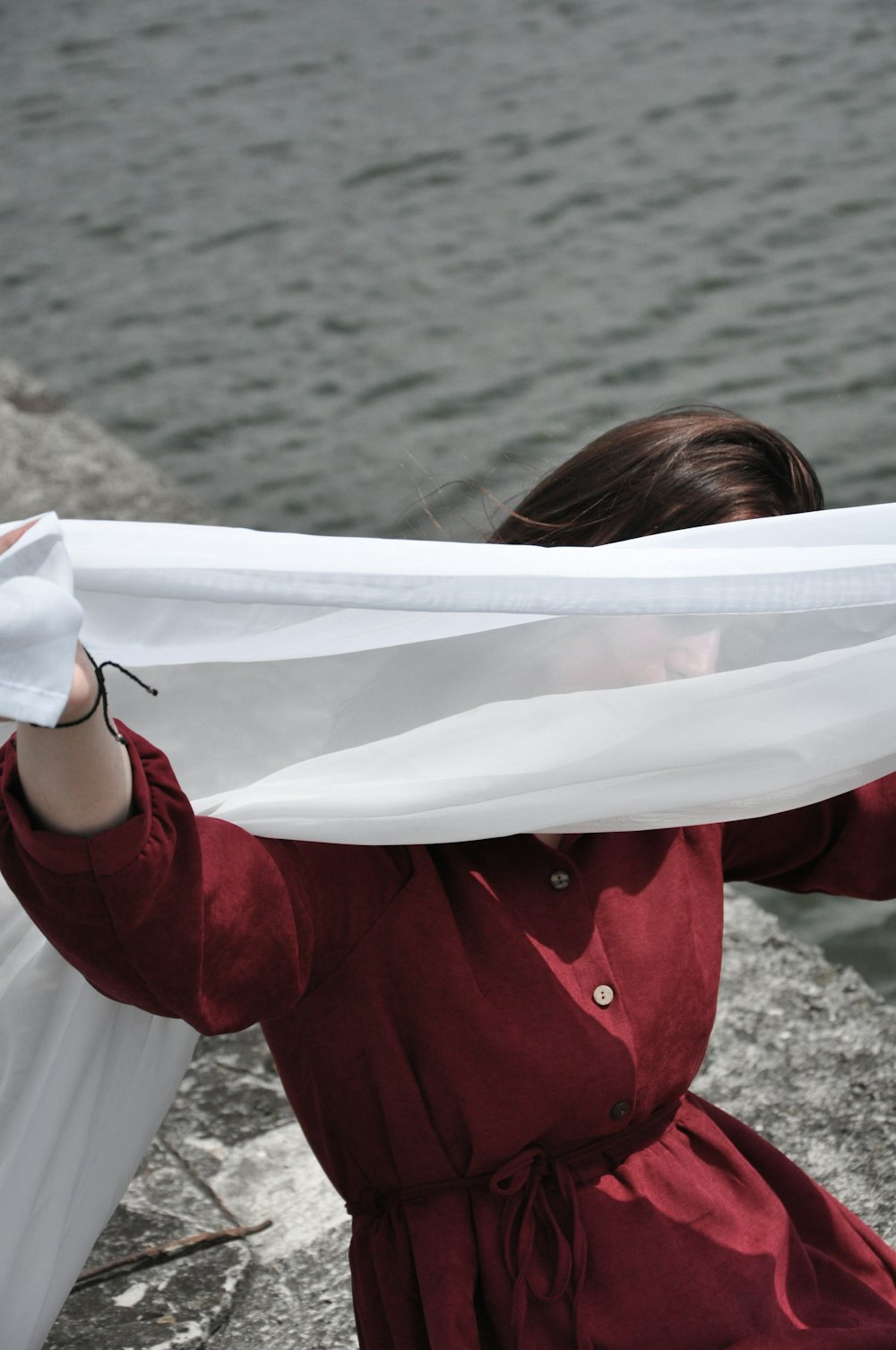 woman holding white scarf