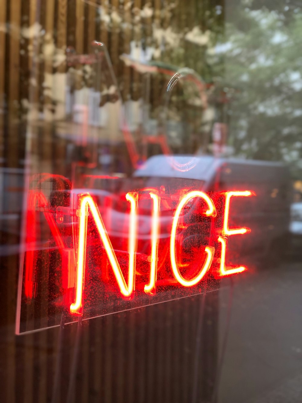shallow focus photo of red nice neon light signage