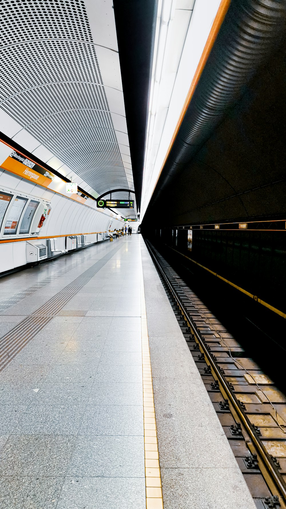 white and orange train station