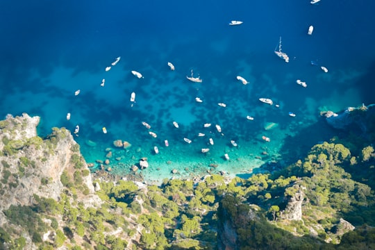 white and green mountain beside seashore in Capri Italy