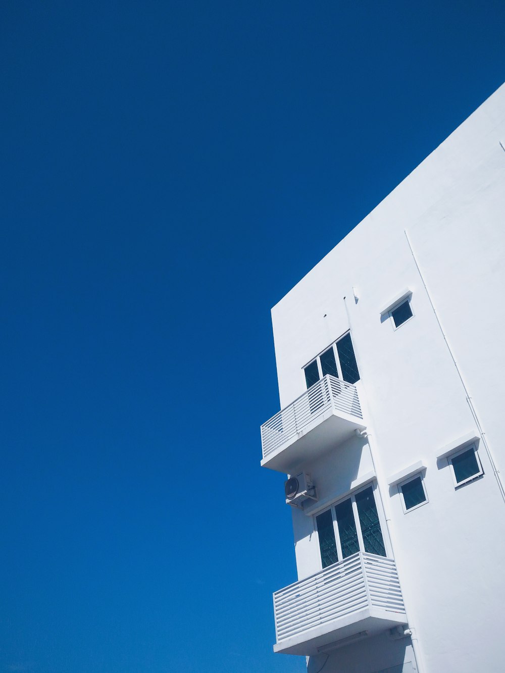 low angle photography of white concrete building