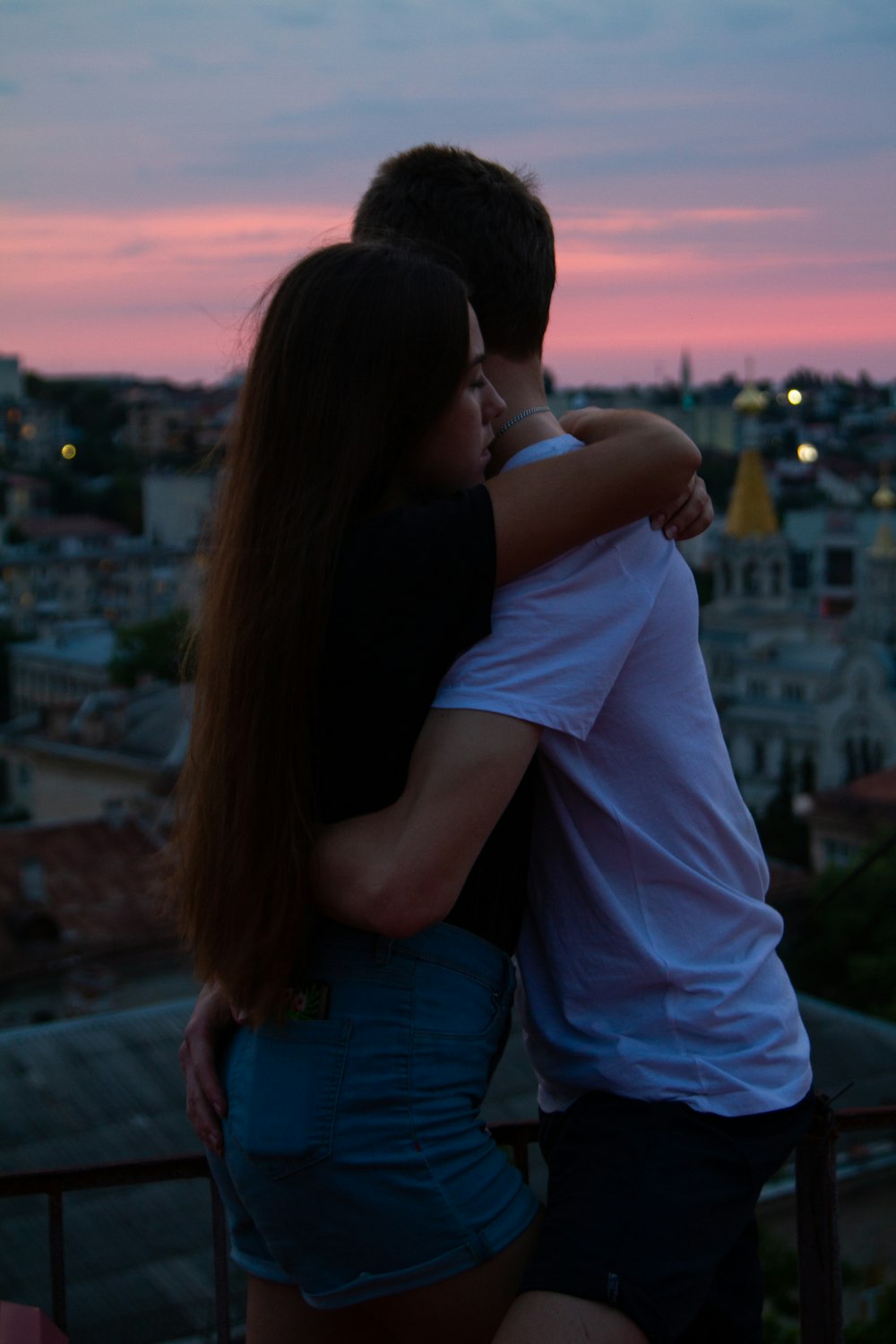 man and woman near houses