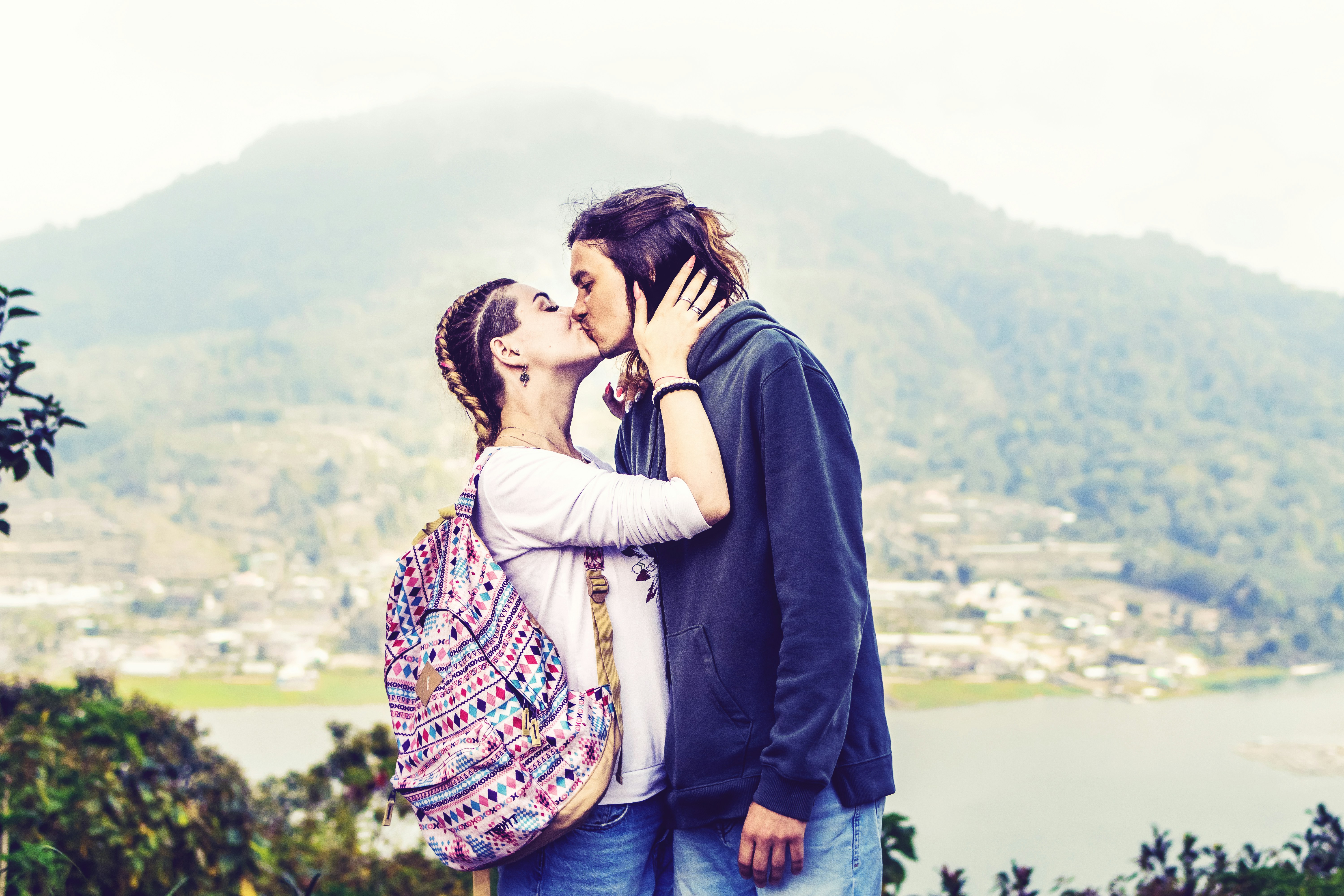A man and a woman standing next to each other photo – Free Blue Image ...