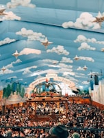 A panoramic view of a decorated venue filled with happy attendees.