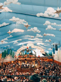 Wide shot of the large function hall set up for a lively community event with festive decorations