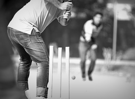 a man swinging a bat at a ball
