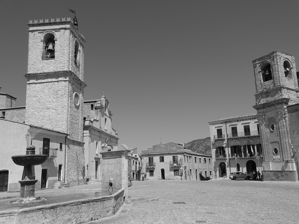 grayscale photo of concrete buildings