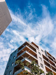 a tall building sitting next to a tall building
