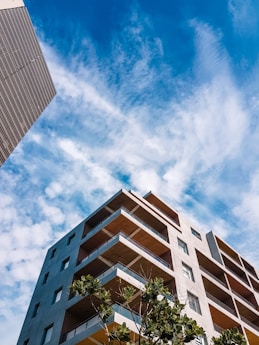 a tall building sitting next to a tall building