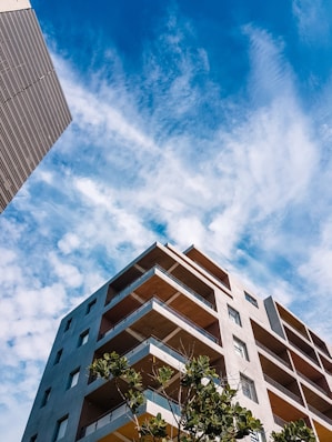 a tall building sitting next to a tall building