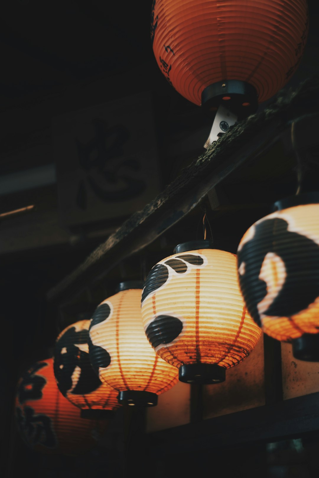 lighted chinese lanterns hanging on the roof