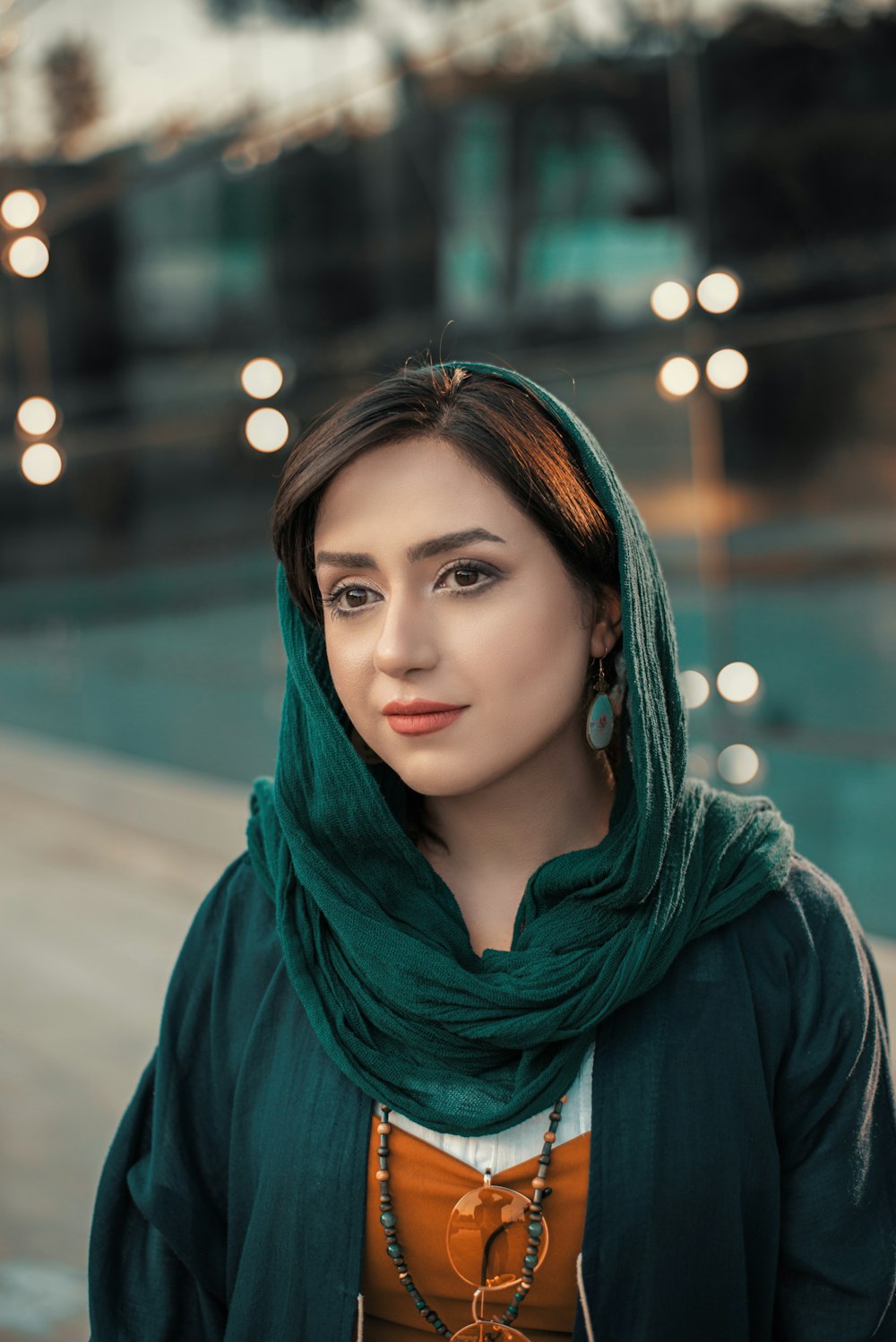 woman wearing green hijab headscarf standing
