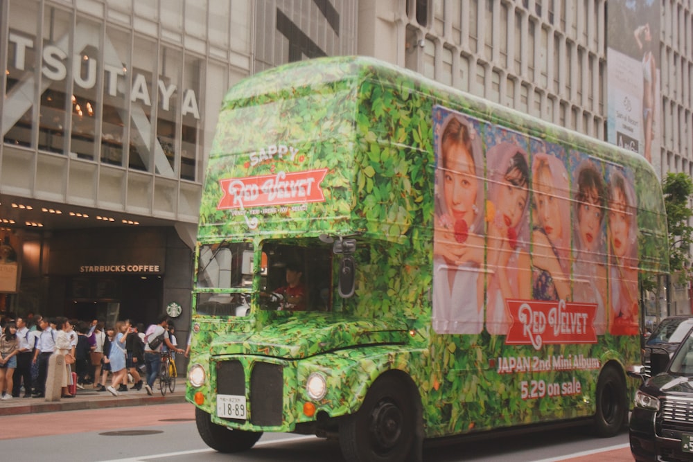 green bus near building