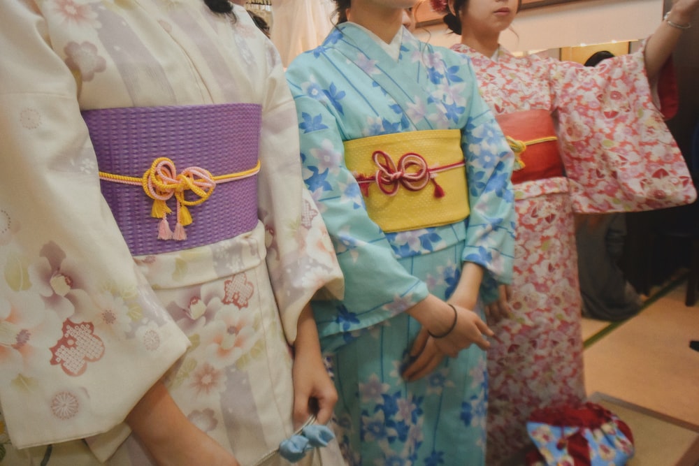 three women wearing kimonos