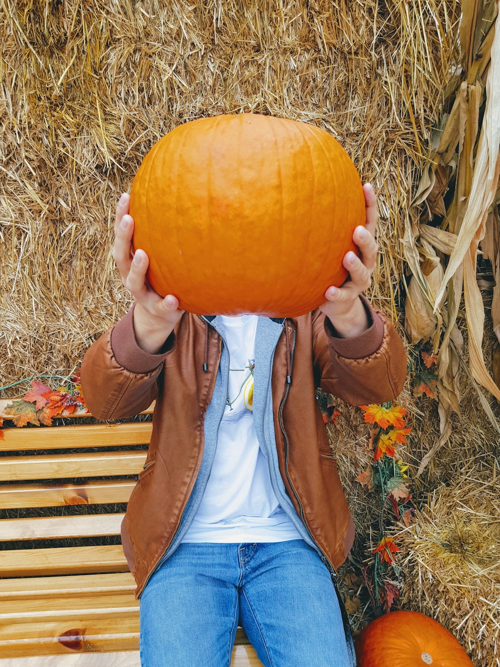 person holding pumpkin