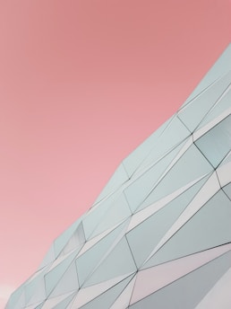 a building with a pink sky in the background