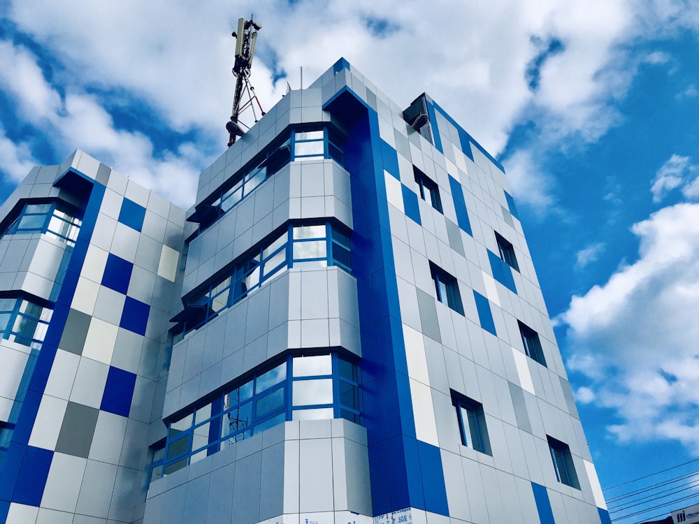 a tall building with blue and white tiles on it