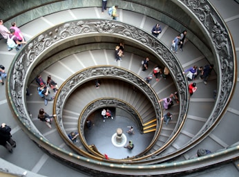 golden ratio for photo composition,how to photograph spiral stairs in museum of vaticano, italy, april 2015; people walking in spiral staircase