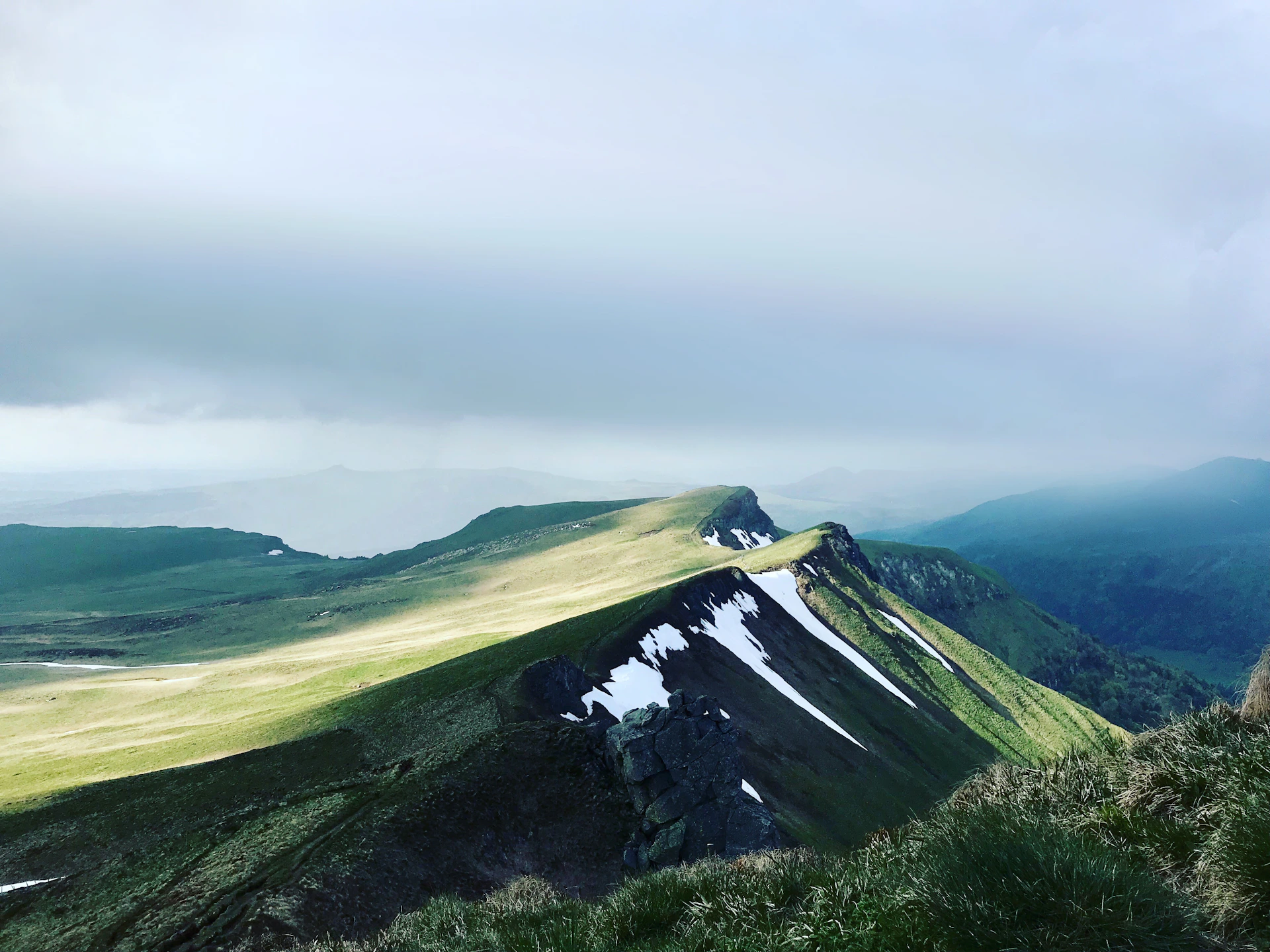 mountain under cloudy sky during daytime