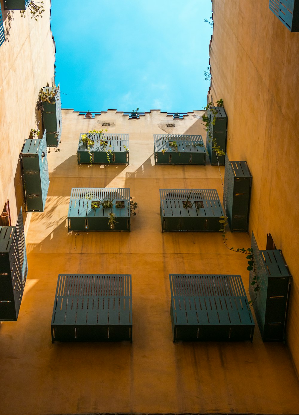 low-angle photography of blue metal windows