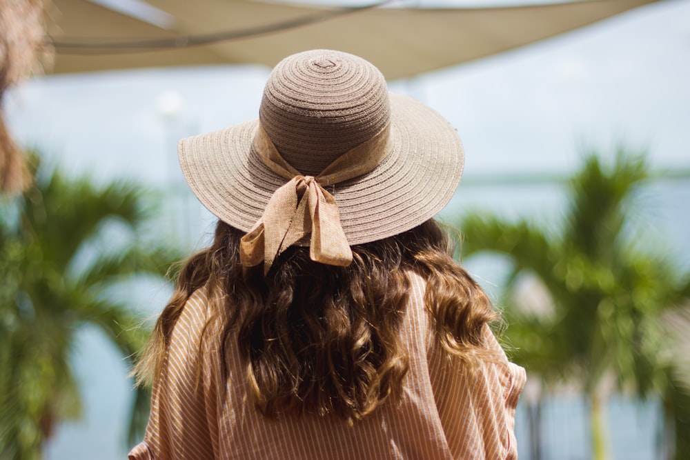 woman wears grey hat