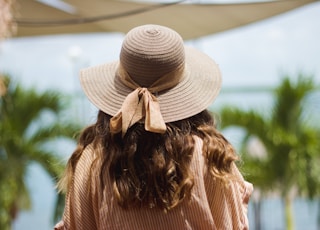 woman wears grey hat