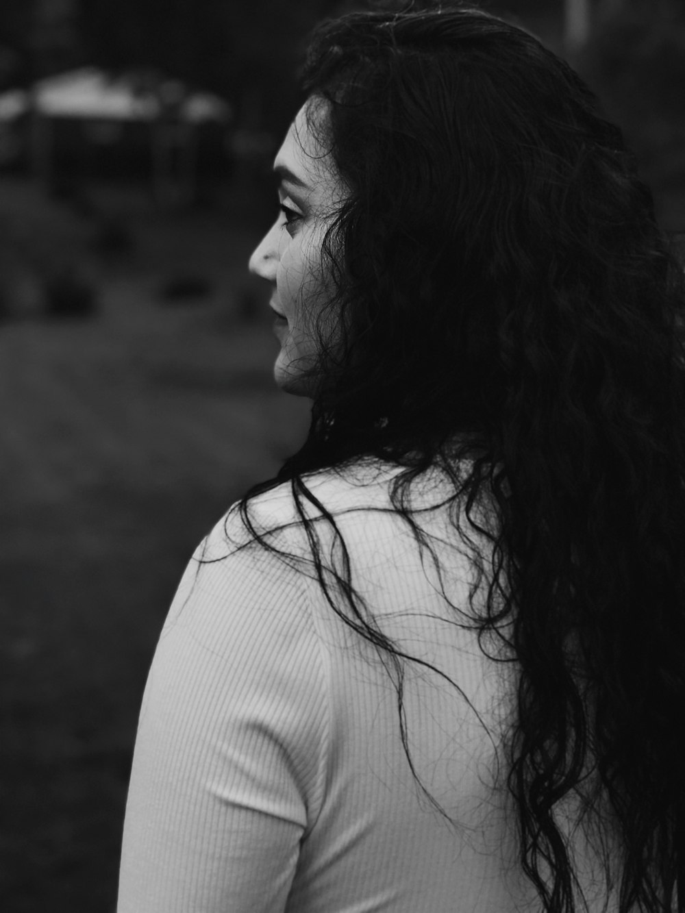 grayscale photography of woman wearing white top