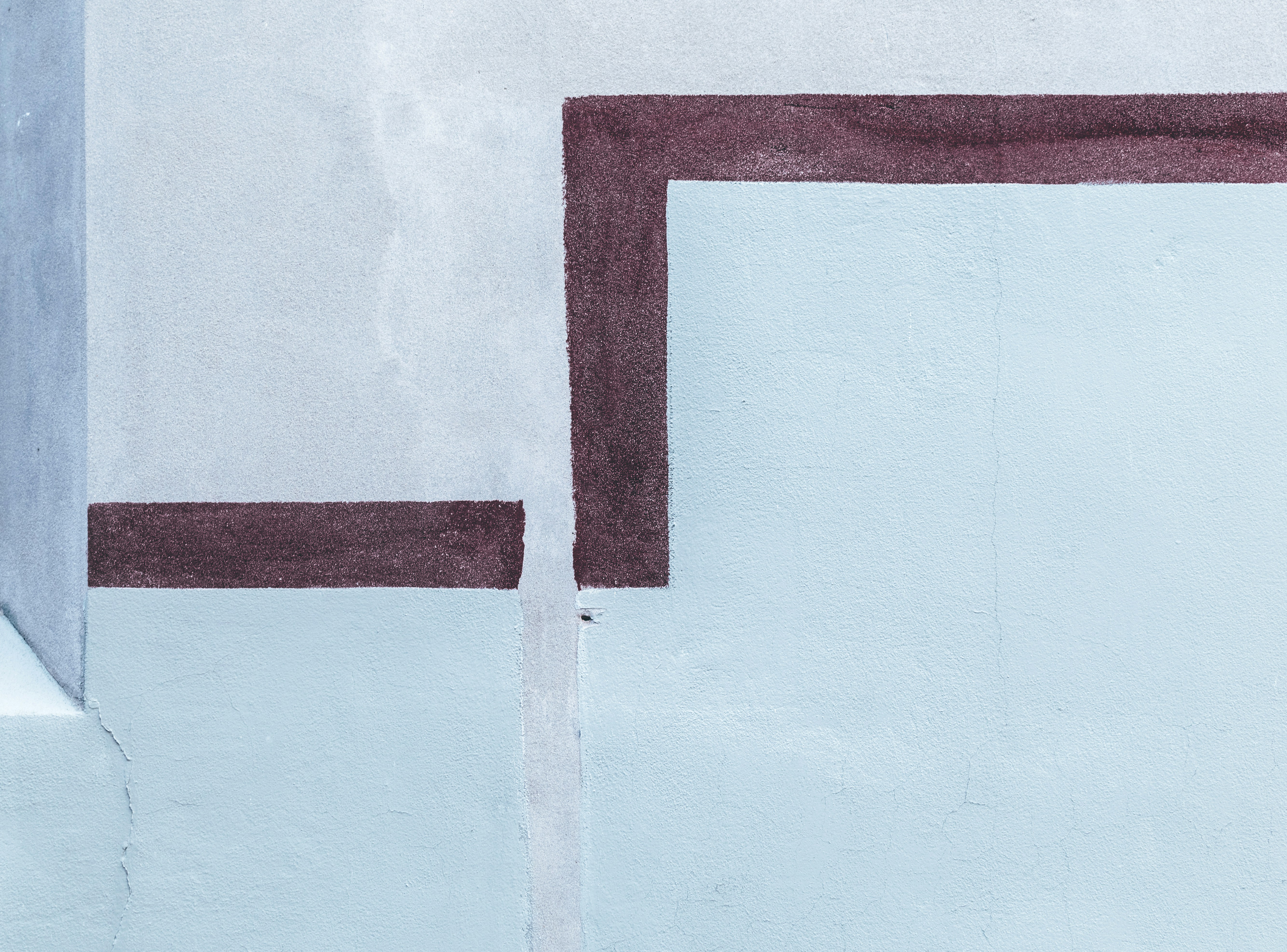 a painting of a white wall with a red border