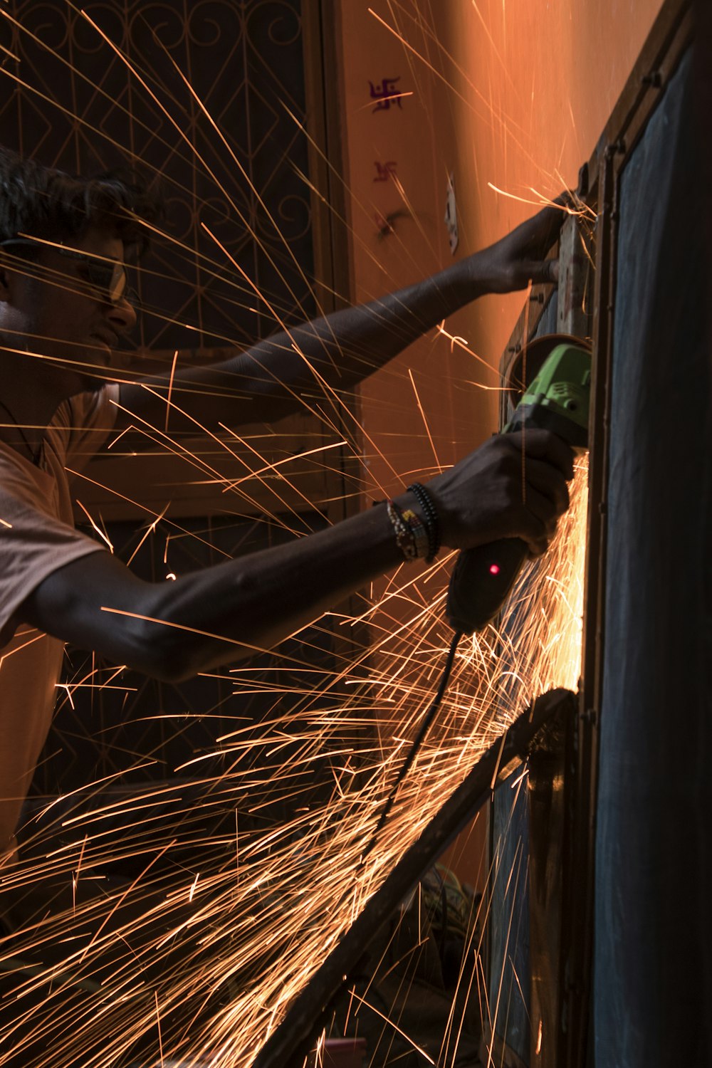 welders working on a piece of metal in a factory