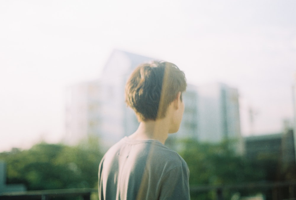 man standing near trees