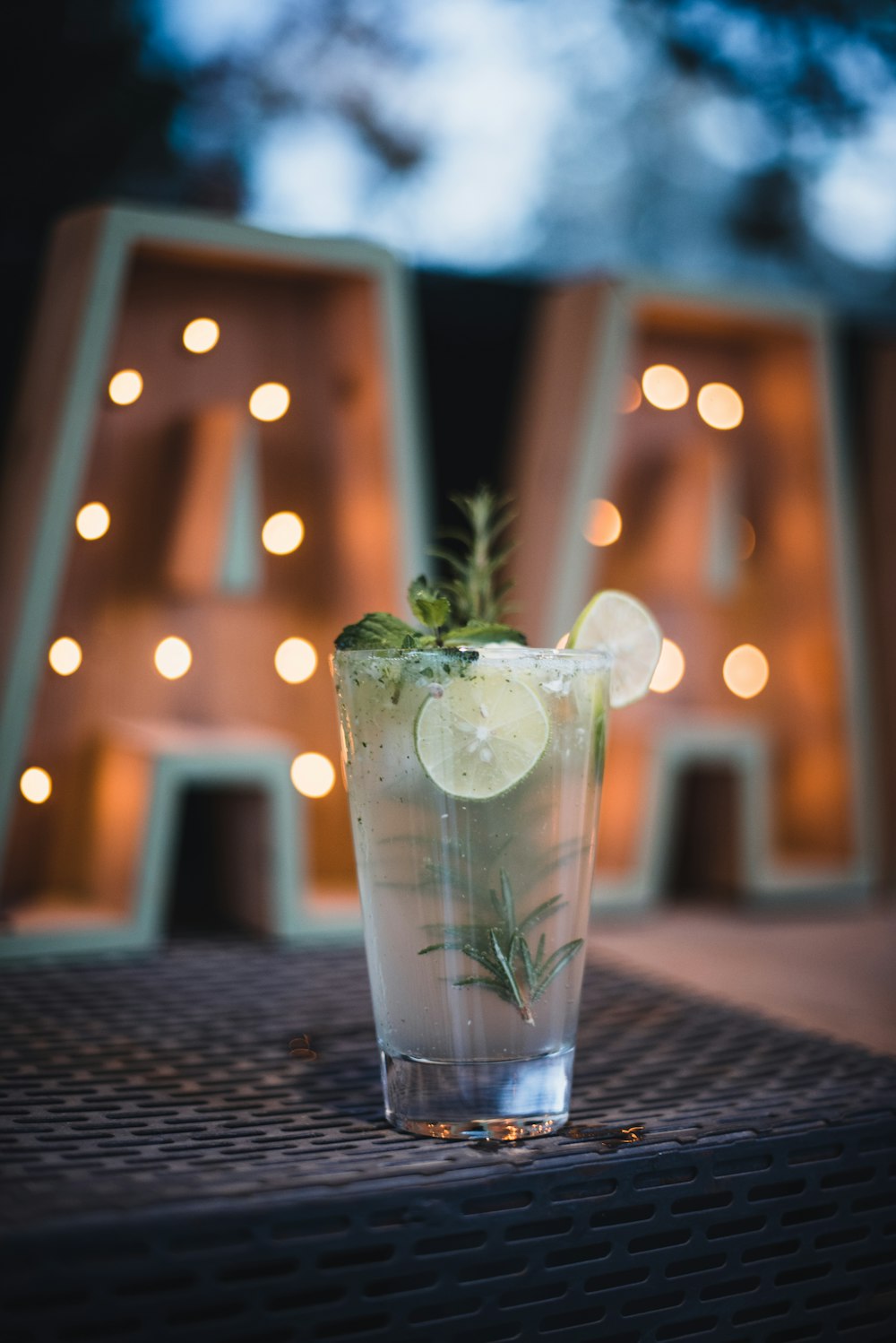 glass of cocktail drink on patio table