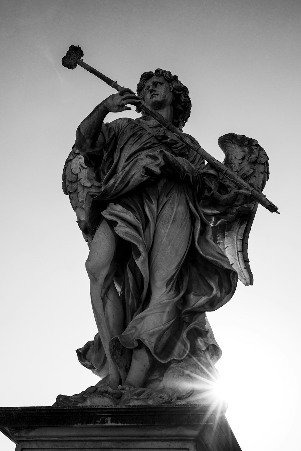 greyscale photography of angel statue