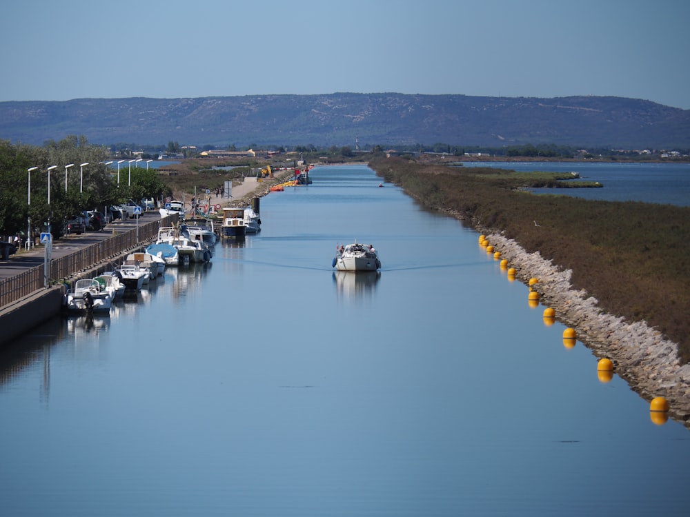 boats on calm body of water