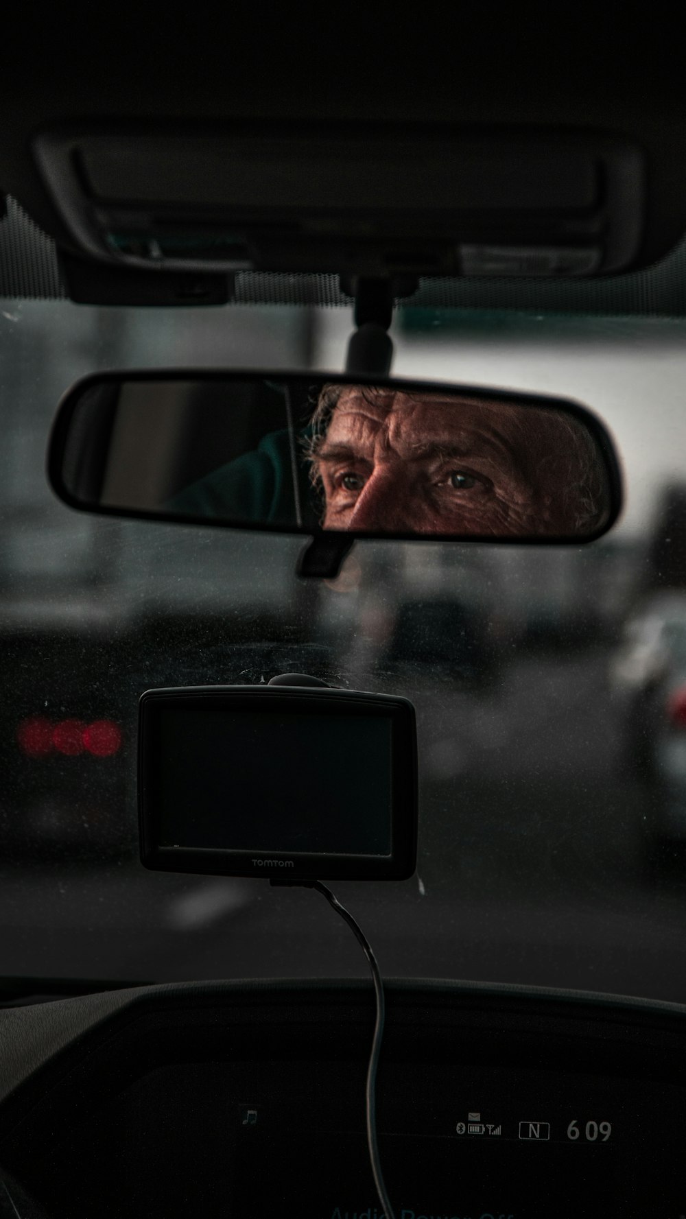rear view mirror with man's eyes reflection