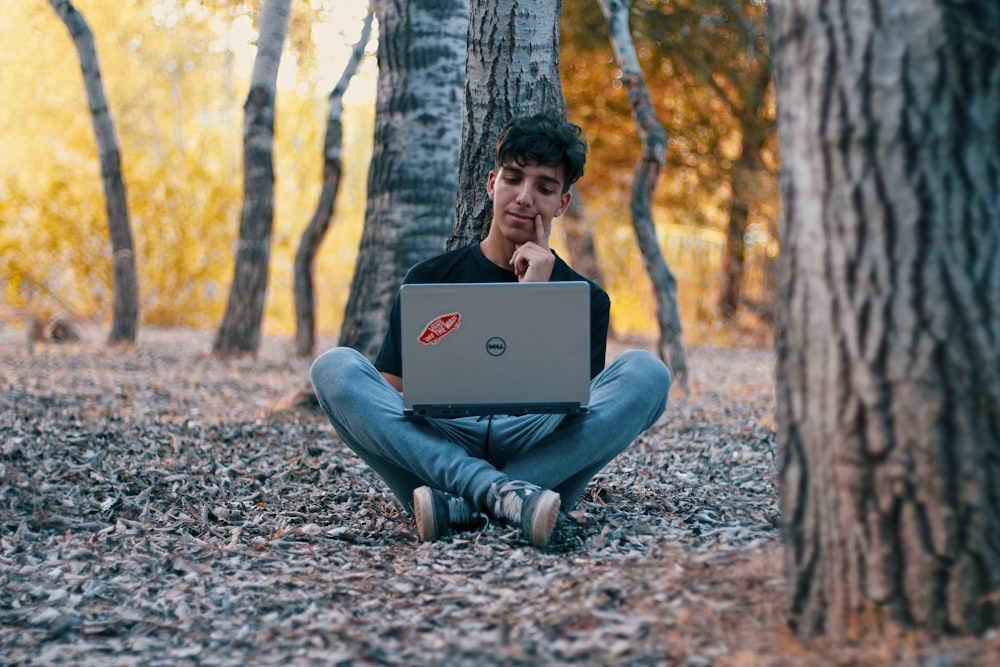 man using Dell laptop