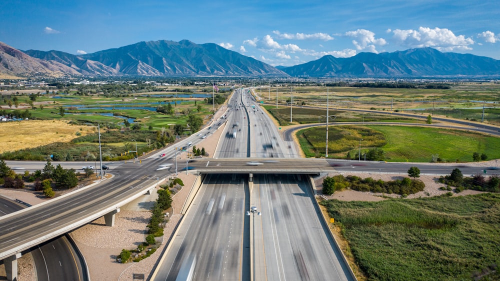 vehicle on road under blue sky