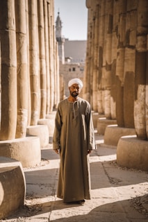 man stands between columns