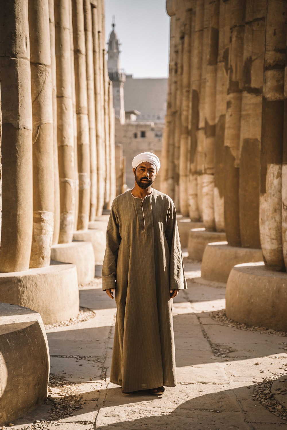 man stands between columns