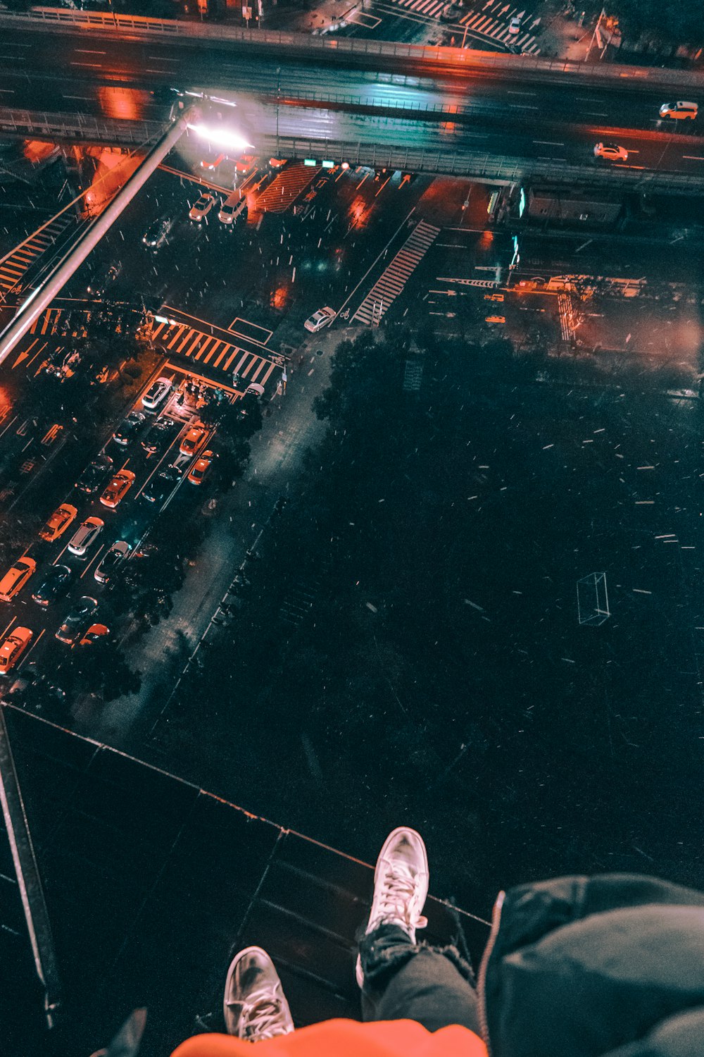 a person standing on top of a tall building