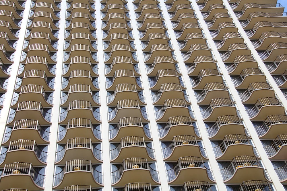 a very tall building with many balconies on it