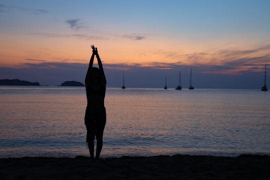 silhouette of person raising hand in Menorca Spain