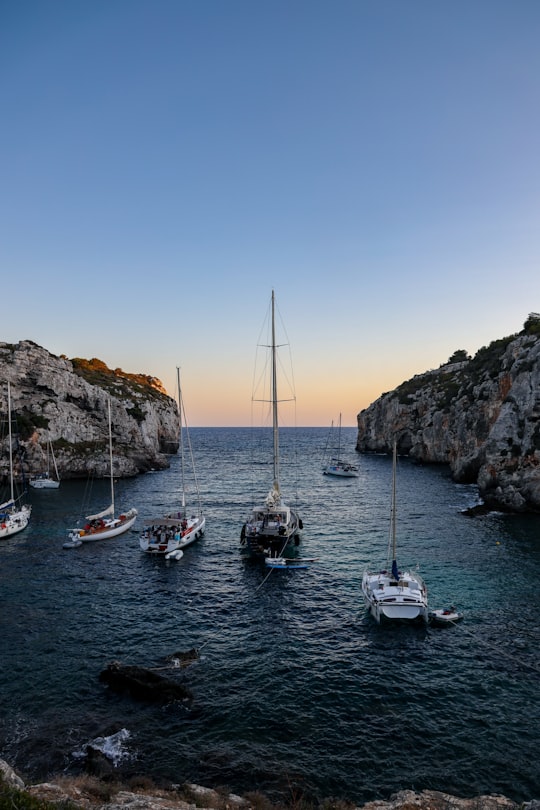 white power boats on body of water in Menorca Spain