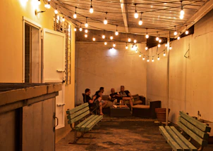 A friendly contractor discussing remodeling plans with a happy Texas family on their patio.