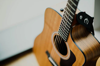 brown cutaway acoustic guitar