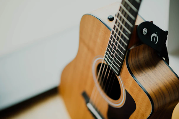 brown cutaway acoustic guitar