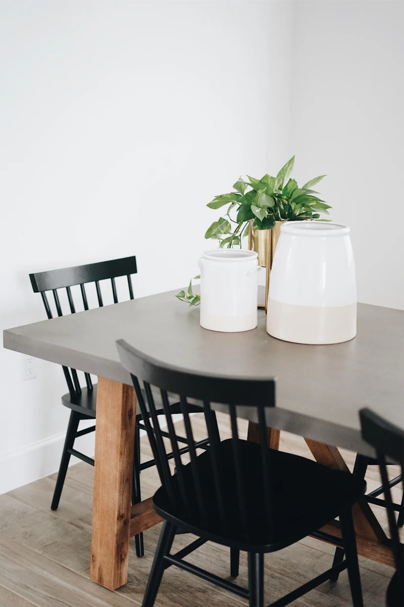 Round dining table with upholstered chairs in a bright room