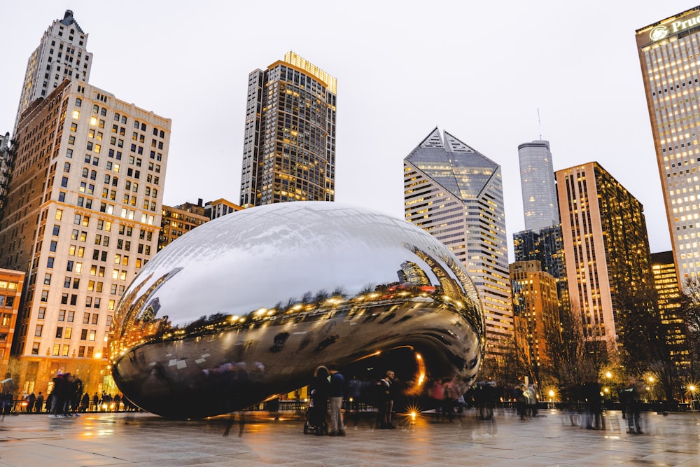 people standing near Cloud Gate during daytime