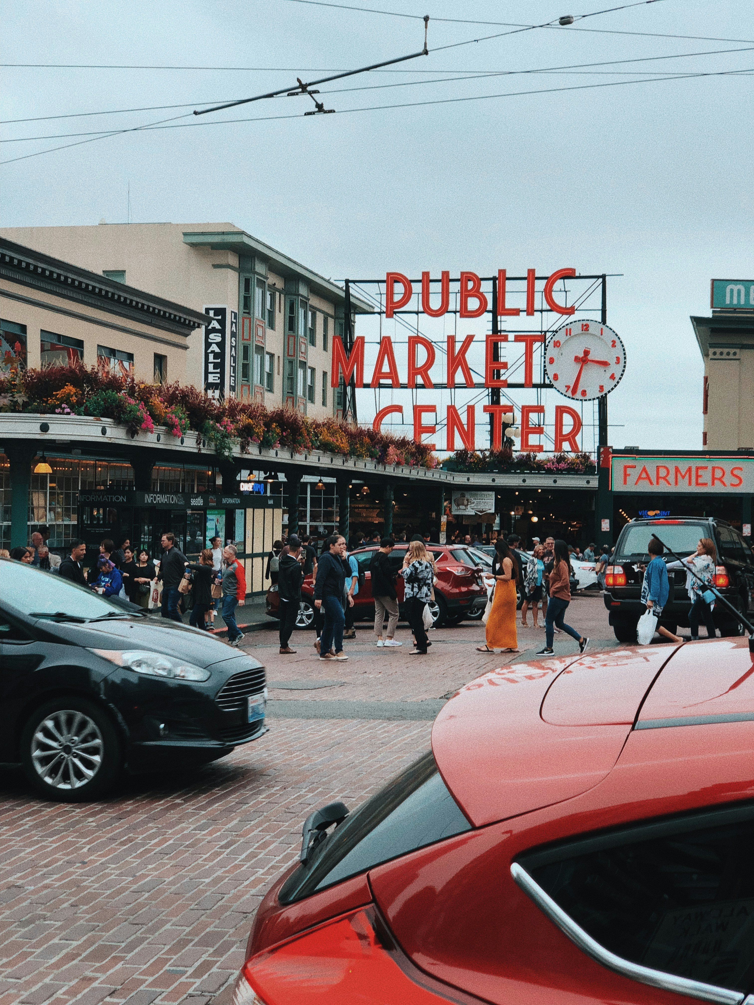 people walking near public market center during daytime