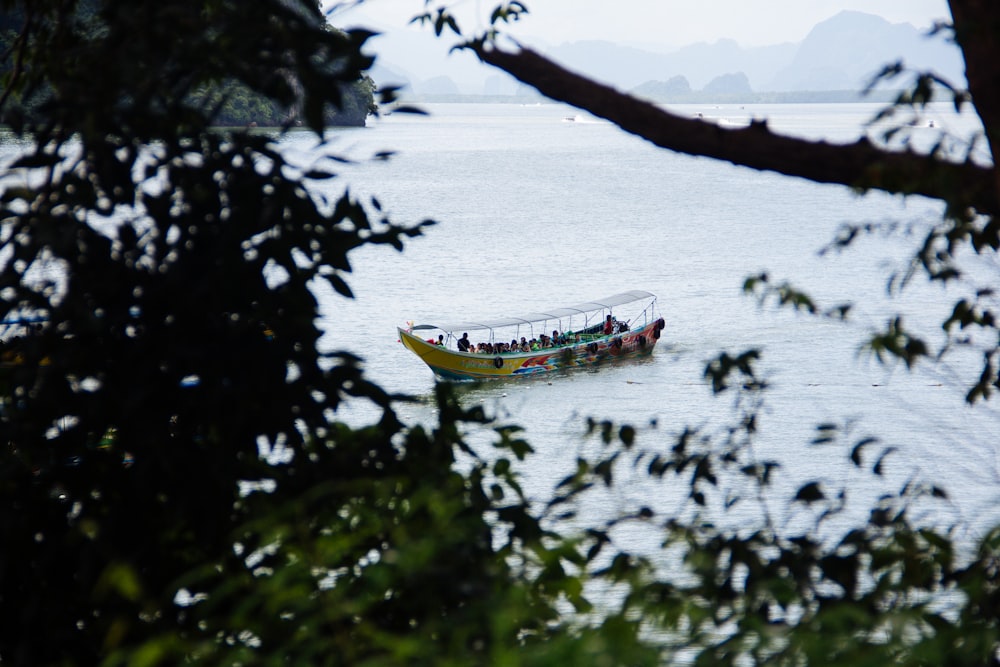 yellow and white boat during daytime photo