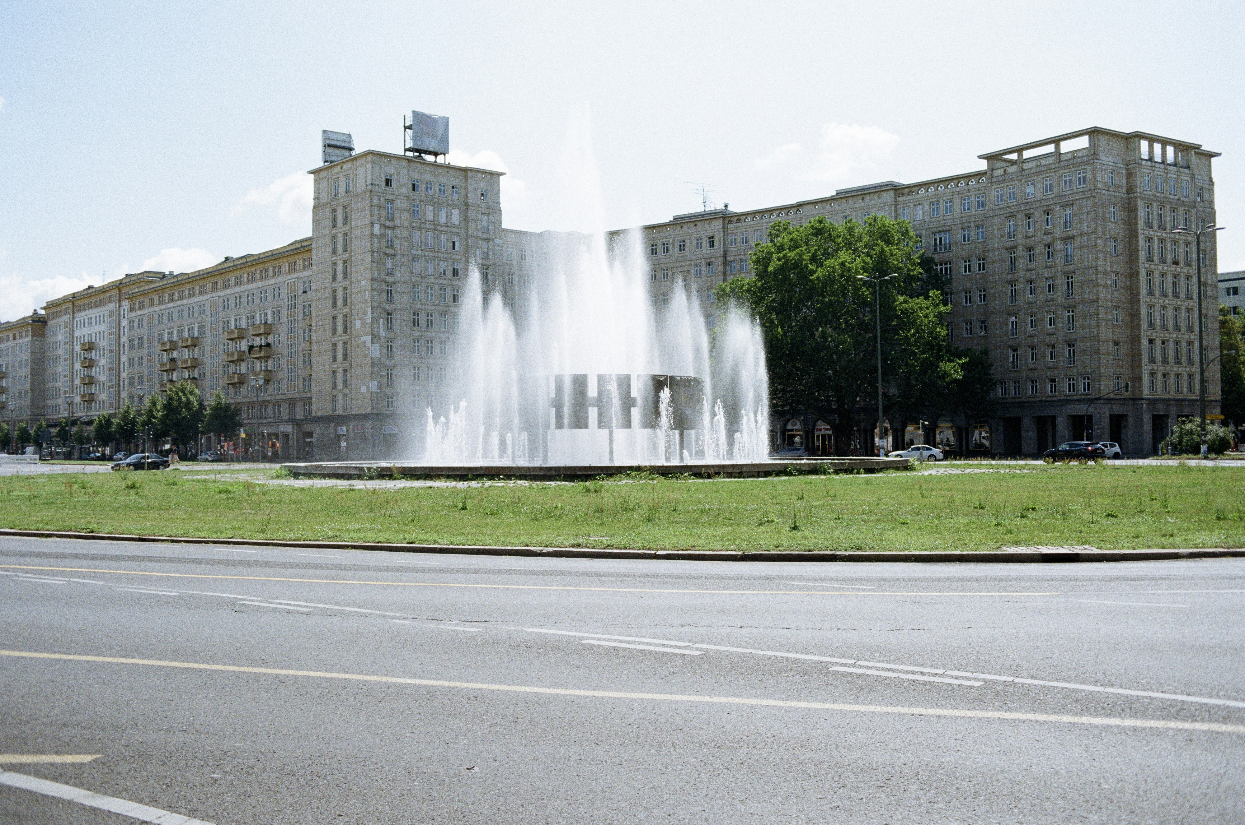 fountain outside concrete buildings